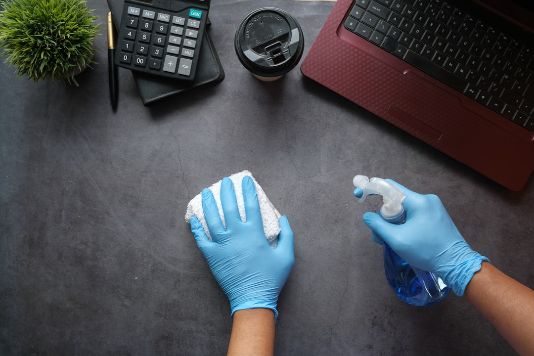 about-us person-in-blue-long-sleeve-shirt-sitting-beside-black-laptop-computer-9gpkrsbgmc